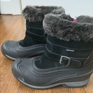 Women’s The North Face black ski boots. Size 9.